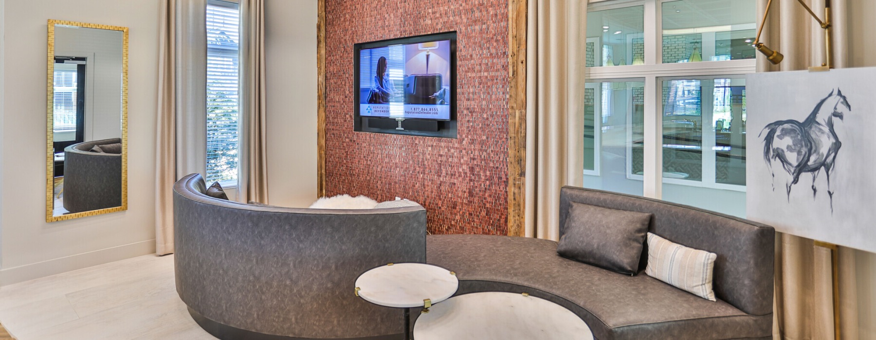Modern resident clubhouse and lounge seating area at Capital Club at Indian Land luxury apartments in Indian Land, SC