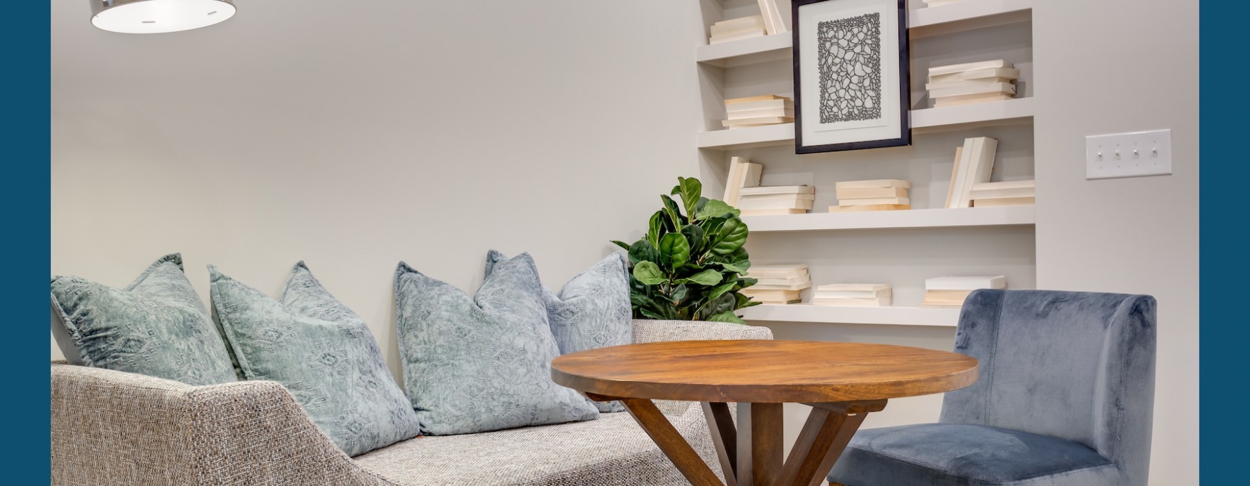 Cozy lounge with built-in bookcase at Capital Club Apartments